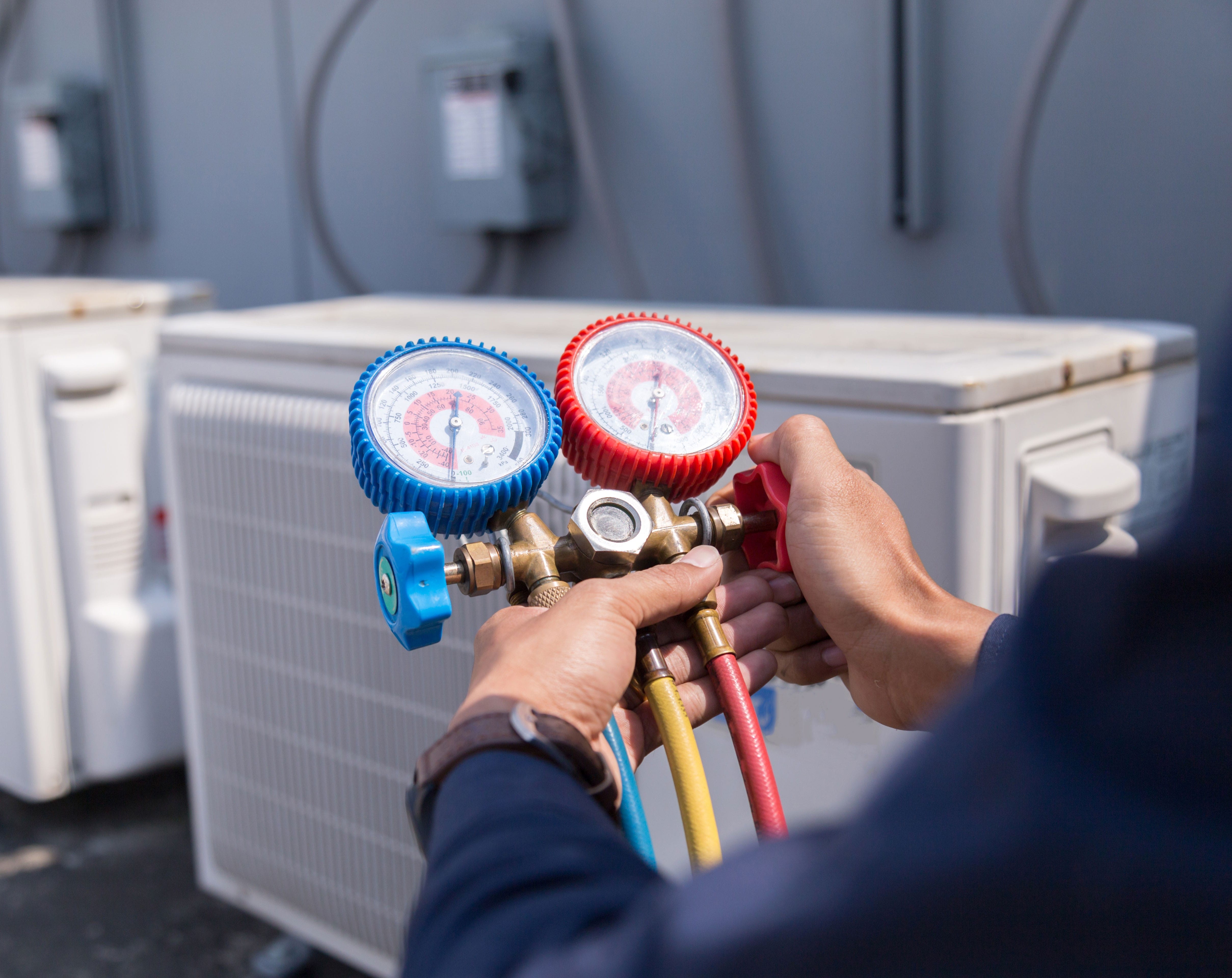 Man Checking The Commercial Air Condition